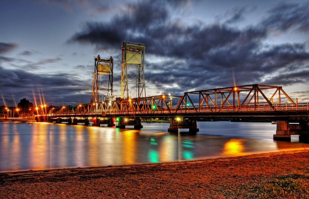 A bridge over the water at night