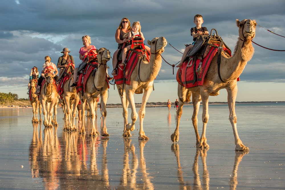 Camel rides up Broome’s famous Cable Beach, Western Australia.