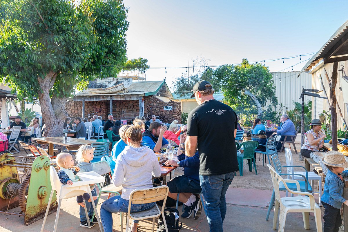 A crowd of people enjoying a day outside a brewery