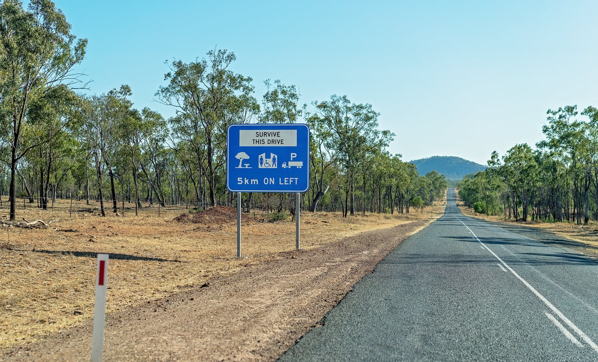 ‘Survive The Drive’ sign on Australian road - a rest stop for long-distance travellers.