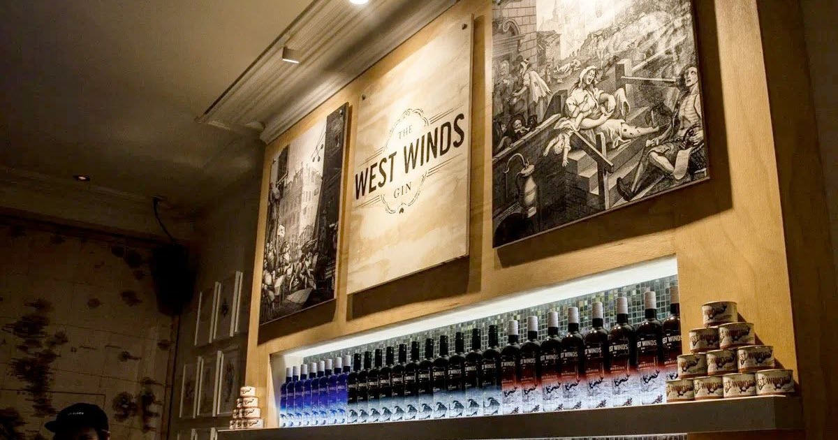 Behind the bar with logo of West Winds Gin in Western Australia's south west.