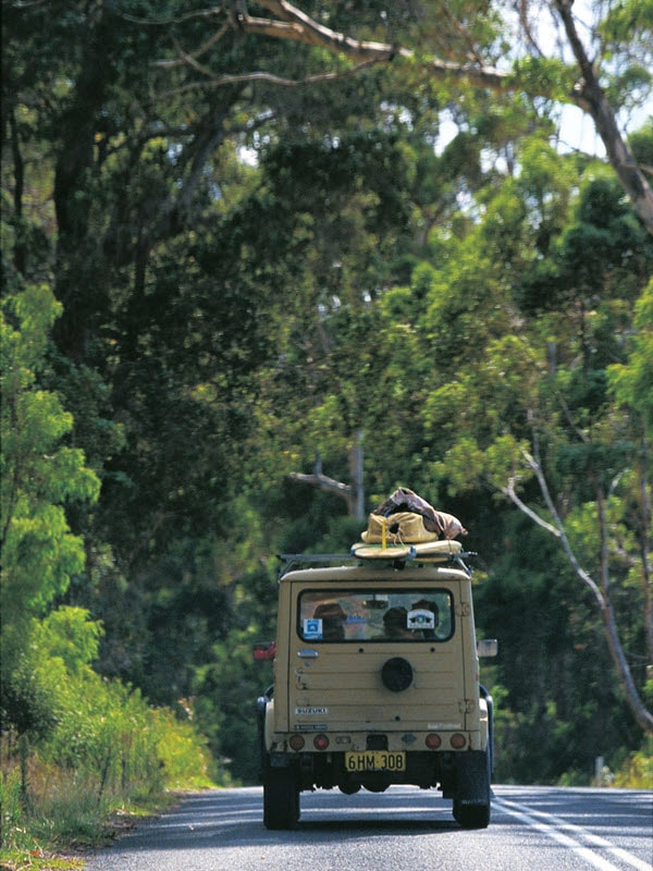 Car driving up caves road in margaret river