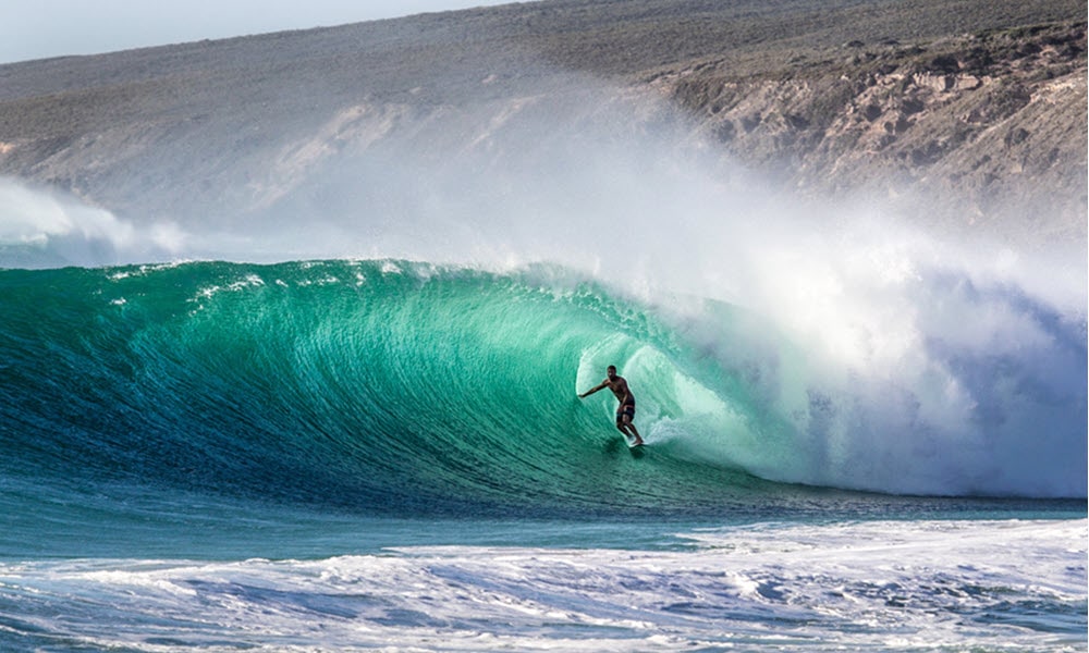 surfer riding barrel in north point, gracetown