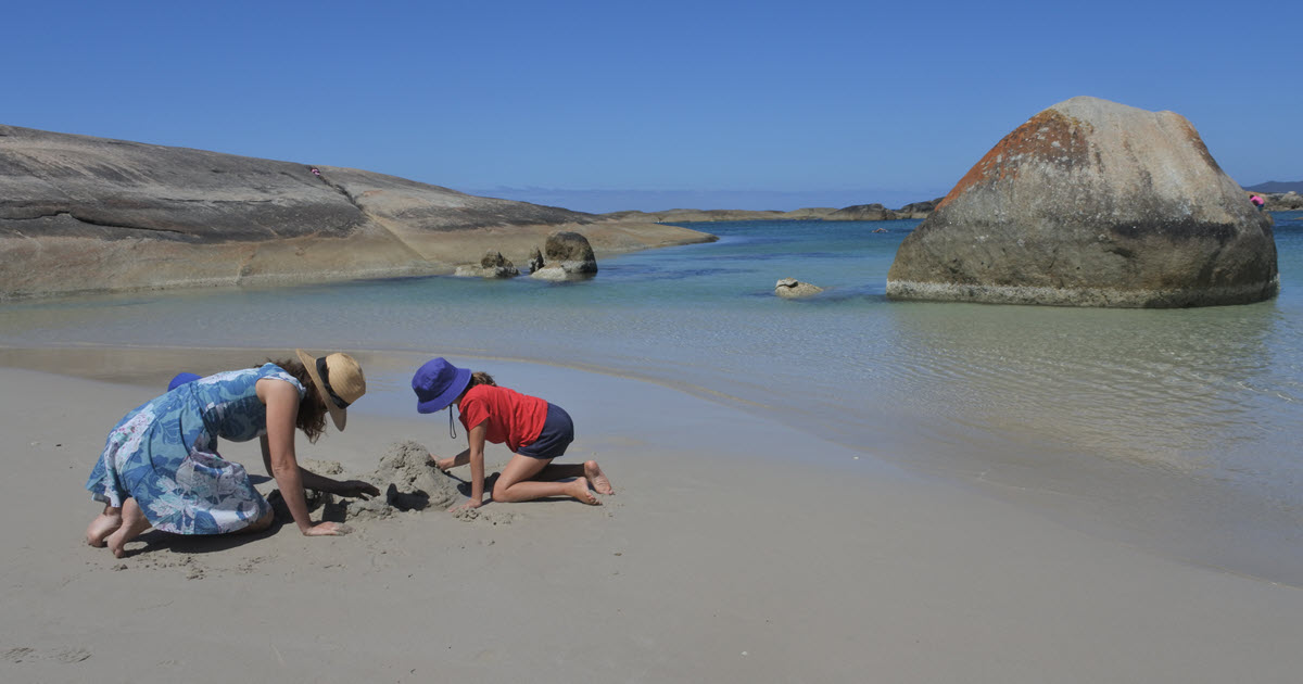 Mother and daughter building sandcastles near Peaceful Bay, WA.