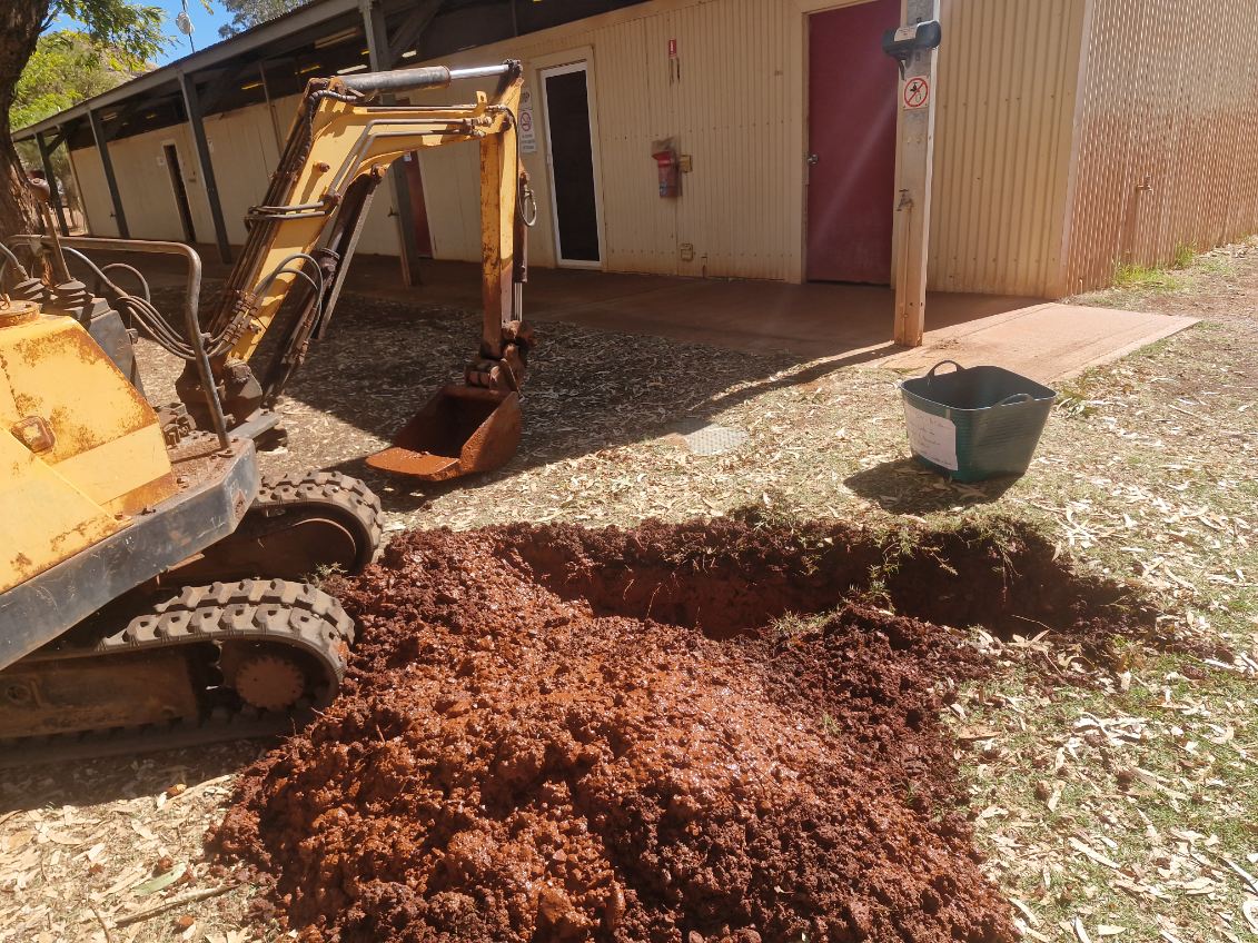 Digging to find udnerground leaks.