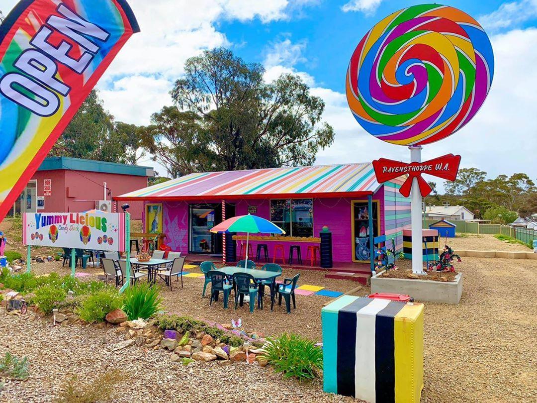 A brightly multi-coloured candyshop with outdoor seating